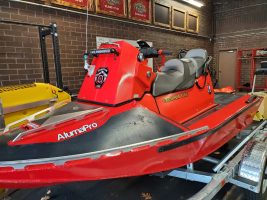 Red jet ski with labels