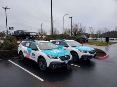 Two cars with matching color decals from Hollywood Sign and Graphics